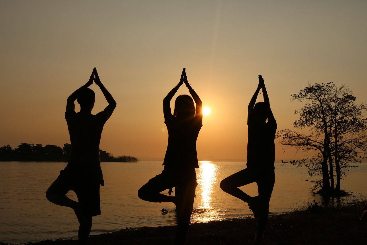 Yoga teacher guiding student in a serene studio